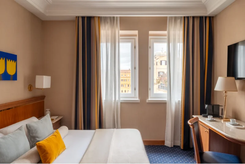Elegant suite with bright double bedroom, twin windows and views of historic Roman buildings near Termini and Piazza della Repubblica - Hotel Diocleziano, BZAR hotels in Rome