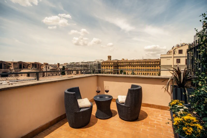 Panoramic terrace with armchairs and Rome rooftop views - Hotel Diocleziano, BZAR hotels in Rome